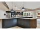 Modern kitchen with stainless steel appliances, granite countertops, and ample cabinet space at 3308 Landing Pl, Palm Harbor, FL 34684