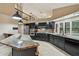 Modern kitchen with stainless steel appliances, granite countertops, and a view to the second story at 3308 Landing Pl, Palm Harbor, FL 34684