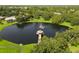 Aerial view of a gazebo at the center of the neighborhood lake at 3308 Landing Pl, Palm Harbor, FL 34684