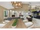 Spacious living room with a fireplace, modern decor, and a view of the kitchen at 3308 Landing Pl, Palm Harbor, FL 34684