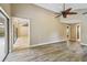 Open floor plan living room with wood floors, high ceilings, and natural light at 3308 Landing Pl, Palm Harbor, FL 34684