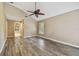 Spacious main bedroom with hardwood flooring, vaulted ceilings and bright windows with plantation shutters at 3308 Landing Pl, Palm Harbor, FL 34684