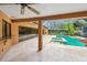 Backyard featuring a swimming pool, hot tub and a covered patio at 3308 Landing Pl, Palm Harbor, FL 34684