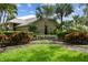 Community signage for 'The Estates' surrounded by manicured landscaping at 3308 Landing Pl, Palm Harbor, FL 34684