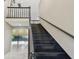 Dark wood staircase leading to the upper level of the home at 3308 Landing Pl, Palm Harbor, FL 34684
