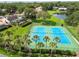 Aerial shot of community tennis courts and landscaping at 3308 Landing Pl, Palm Harbor, FL 34684