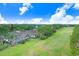Beautiful aerial view of the property with the golf course, pool and screened in patio at 3519 Old Course Ln, Valrico, FL 33596