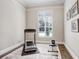 Light and bright exercise room with a treadmill, a bench, and natural light at 3519 Old Course Ln, Valrico, FL 33596