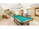 Spacious game room with pool table, bar area, and ample seating at 3519 Old Course Ln, Valrico, FL 33596