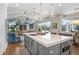 The kitchen features a central island with hardwood floors and an open view to the living room at 3519 Old Course Ln, Valrico, FL 33596