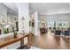 Elegant living room featuring hardwood floors, neutral colors, and a seamless flow into the dining area at 3519 Old Course Ln, Valrico, FL 33596