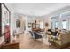 Open living room and dining area featuring hardwood floors and neutral decor, perfect for entertaining at 3519 Old Course Ln, Valrico, FL 33596
