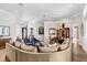 Spacious living room with an open layout, hardwood floors, and seamless transition into the dining area at 3519 Old Course Ln, Valrico, FL 33596