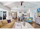 Bright open living space featuring hardwood floors and an eat-in kitchen with a large central island at 3519 Old Course Ln, Valrico, FL 33596
