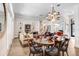 Open-concept living space featuring hardwood floors, a dining area, and a seamless connection to the kitchen at 3519 Old Course Ln, Valrico, FL 33596