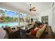 Covered patio with outdoor dining and lounging area overlooking the pool at 3519 Old Course Ln, Valrico, FL 33596