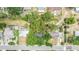 Overhead aerial view highlighting property layout, tree coverage, and neighborhood street patterns at 3812 W Rogers Ave, Tampa, FL 33611