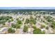 Wide aerial view displaying residential streets, lush greenery, and neighborhood layout at 3812 W Rogers Ave, Tampa, FL 33611