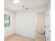 Bedroom featuring hard wood floors that leads to the ensuite bathroom at 3812 W Rogers Ave, Tampa, FL 33611