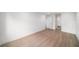 Spacious bedroom with wood floors and a view into the ensuite bathroom at 3812 W Rogers Ave, Tampa, FL 33611