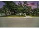 Charming single-story home with large shade trees in the front yard at 3812 W Rogers Ave, Tampa, FL 33611