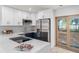 Stylish kitchen featuring modern appliances, white countertops, and elegant cabinetry at 3812 W Rogers Ave, Tampa, FL 33611