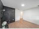 Spacious living room with new floors and a striking black brick fireplace feature at 3812 W Rogers Ave, Tampa, FL 33611