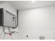 Efficient tankless water heater installed on a utility room wall at 3812 W Rogers Ave, Tampa, FL 33611