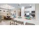 Stylish kitchen with white quartz countertops, stainless steel appliances and pendant lighting at 3869 Consolare Ct, Wesley Chapel, FL 33543