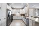 Modern kitchen with stainless steel appliances, white cabinets, and undermount sink at 3869 Consolare Ct, Wesley Chapel, FL 33543