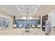 Grand lobby area with high ceilings, pendant lighting, and comfortable seating at 3869 Consolare Ct, Wesley Chapel, FL 33543