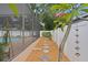 Backyard shot showing pool, landscaping, walkway with stepping stones and white fence at 4012 N Munro St, Tampa, FL 33603