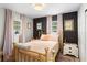 Serene bedroom featuring soft colors, natural light, and a classic brass bed frame at 4012 N Munro St, Tampa, FL 33603