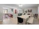 Open-concept dining area with modern decor, hardwood floors, and access to living spaces at 4012 N Munro St, Tampa, FL 33603