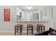 Kitchen with granite breakfast bar and 3 barstools at 4012 N Munro St, Tampa, FL 33603