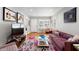 Bright living room featuring hardwood floors, modern decor, and comfortable seating, perfect for relaxation at 4012 N Munro St, Tampa, FL 33603