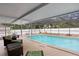 Screened pool features patio, white fencing, and outdoor furniture seating at 4012 N Munro St, Tampa, FL 33603
