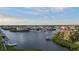 Aerial view of waterfront houses with private docks and the expansive water ways at 4128 Causeway Vista Dr, Tampa, FL 33615