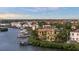 Aerial view of waterfront homes, showcasing the location and nearby docks at 4128 Causeway Vista Dr, Tampa, FL 33615
