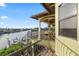 Balcony with water views, exterior spiral staircase and waterfront access at 4128 Causeway Vista Dr, Tampa, FL 33615
