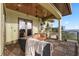 Relaxing balcony featuring outdoor seating, wood floors, and water views at 4128 Causeway Vista Dr, Tampa, FL 33615