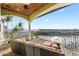 Balcony with a stunning water view, covered ceilings, and water access at 4128 Causeway Vista Dr, Tampa, FL 33615