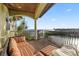 Inviting covered balcony offering water views and features lounge seating at 4128 Causeway Vista Dr, Tampa, FL 33615