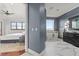 Luxurious bathroom with a freestanding tub, marble tile, and an elegant vanity at 4128 Causeway Vista Dr, Tampa, FL 33615