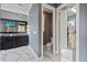Bathroom featuring double sinks, and walk-in closet with a gray colored accent wall paint at 4128 Causeway Vista Dr, Tampa, FL 33615