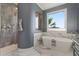 Bathroom featuring a modern soaking tub, tiled shower, and neutral gray paint at 4128 Causeway Vista Dr, Tampa, FL 33615