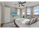 Bright bedroom with outdoor views, recessed lighting, a ceiling fan and a tv at 4128 Causeway Vista Dr, Tampa, FL 33615