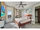 Inviting bedroom with outdoor views, recessed lighting, a ceiling fan and a tv at 4128 Causeway Vista Dr, Tampa, FL 33615