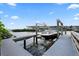 Private boat dock with lift, providing easy access to the water and stunning views for boating enthusiasts at 4128 Causeway Vista Dr, Tampa, FL 33615