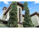 Stunning two-story home featuring a large window and well-maintained landscaping with beautiful tall trees at 4128 Causeway Vista Dr, Tampa, FL 33615